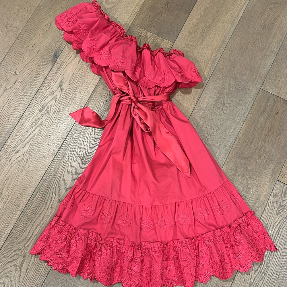 Bright pink ruffled one shoulder dress.